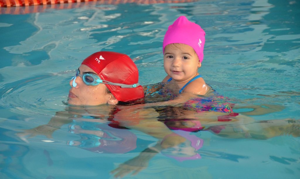TRUE OR FALSE: Involving a child in swimming or other water activities during the winter will cause the child to have an inordinate amount of colds and other illnesses. They can catch cold from going outside with a “wet head”.